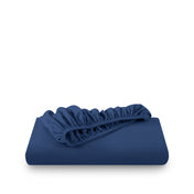 Blue fitted sheet on white background