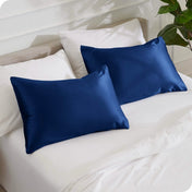 2 mulberry silk pillowcases on pillows set on a bed