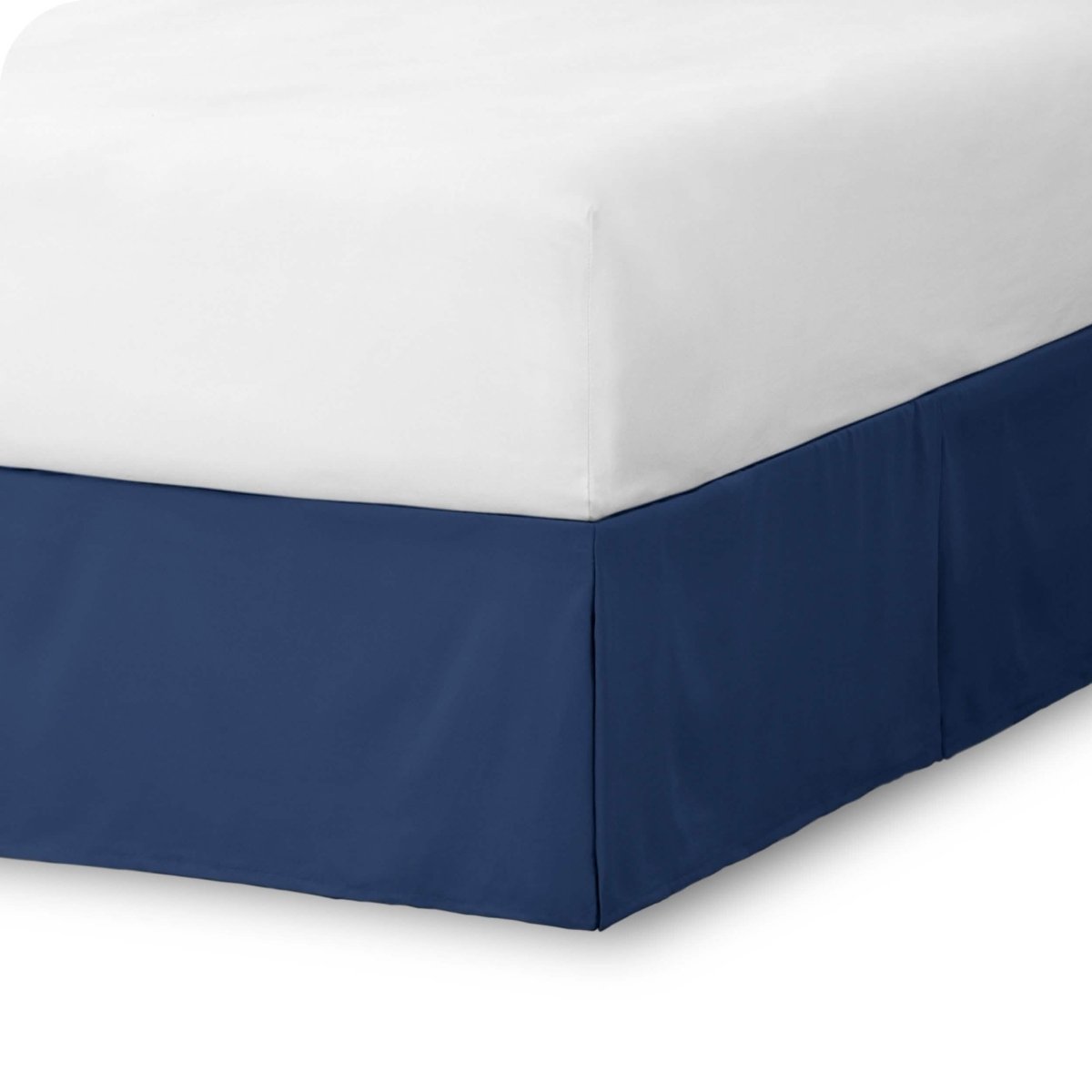 The corner of a bed skirt on a bed frame