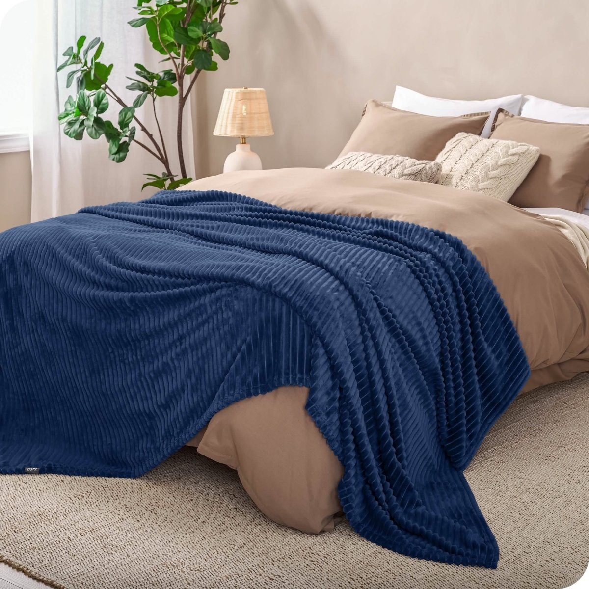 Microplush ribbed blanket on a bed