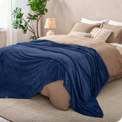 Microplush ribbed blanket on a bed