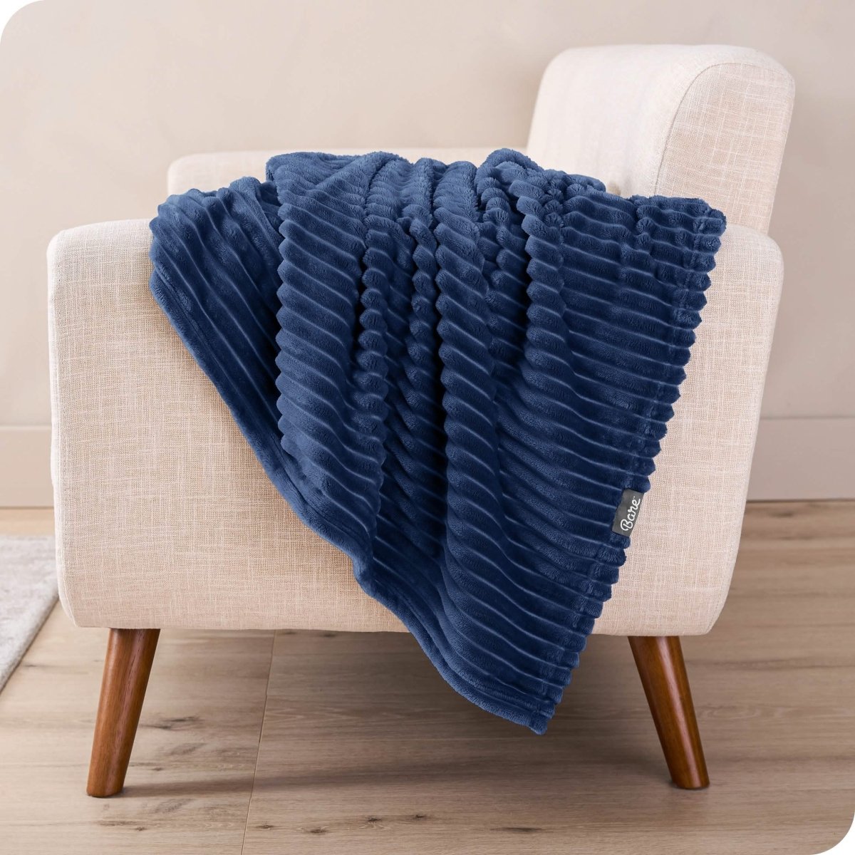 A microplush blanket draped over a chair