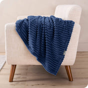 A microplush blanket draped over a chair