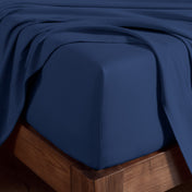 Organic cotton jersey sheet set on a wooden bed frame