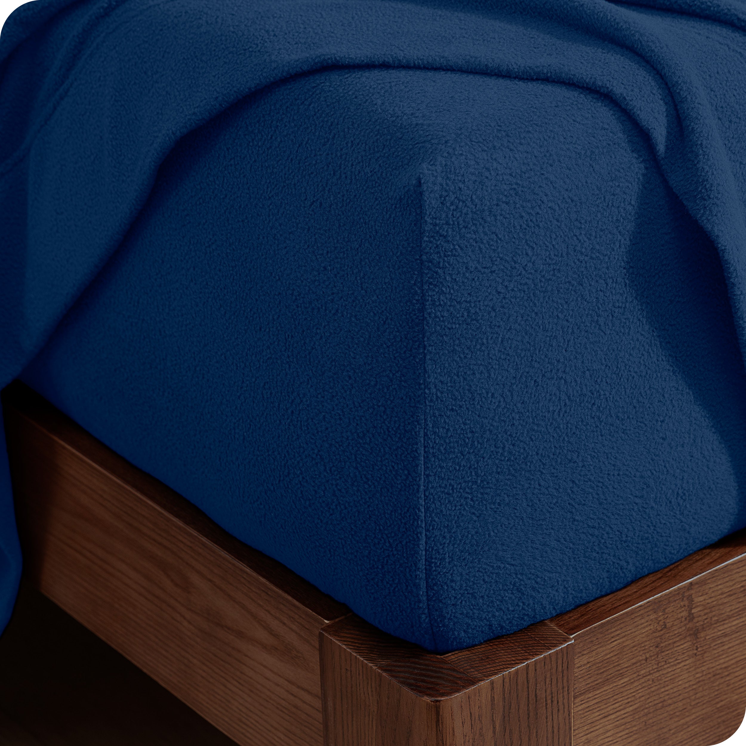 Fitted sheet on a wooden bed frame