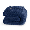 Cable knit faux shearling blanket folded