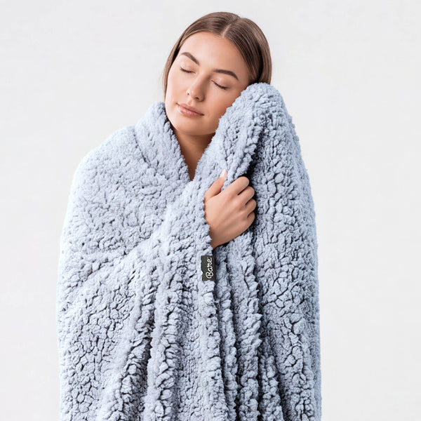 A woman wrapped in a blanket