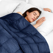 A woman sleeping with a weighted blanket over her body