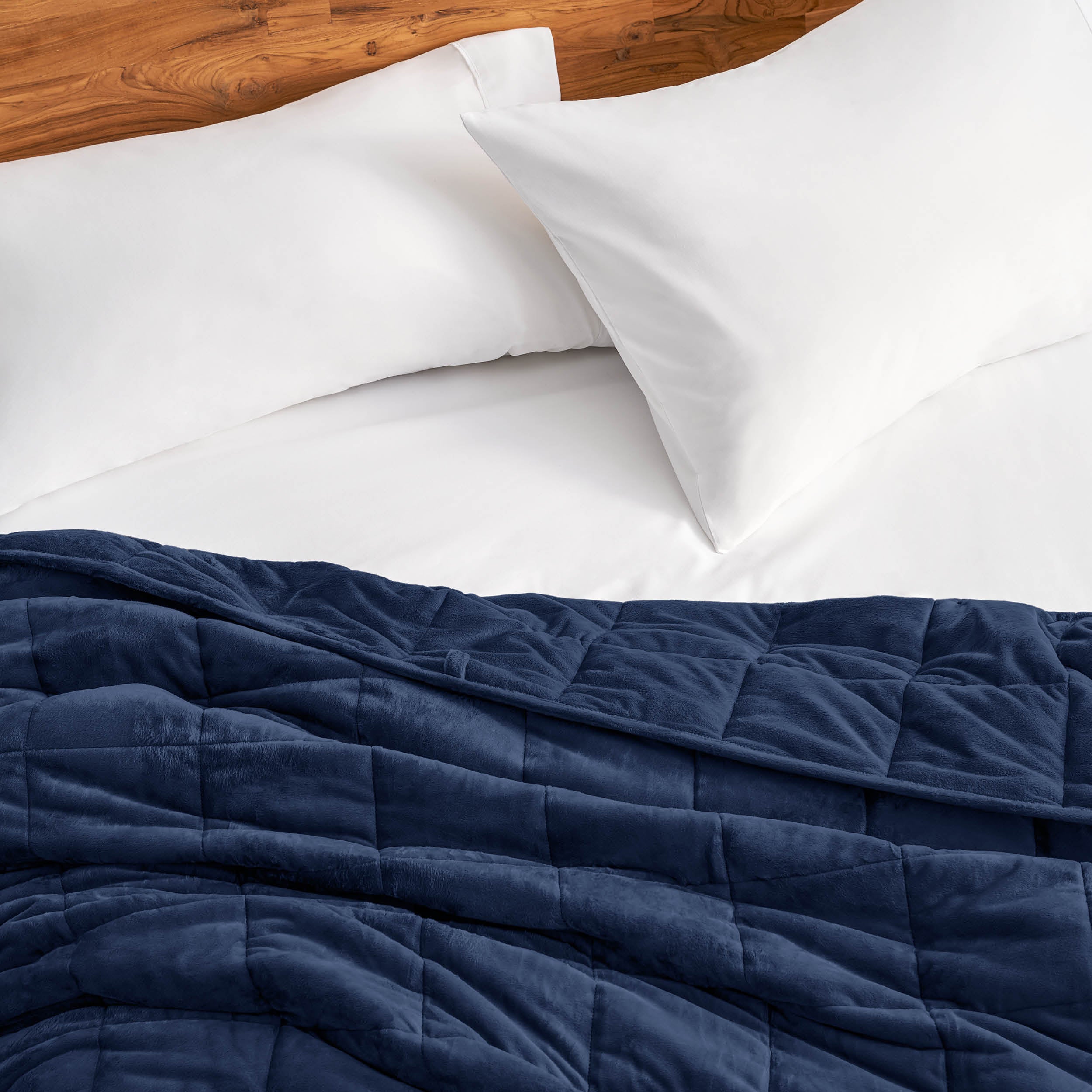 Close-up of a minky weighted blanket on a bed