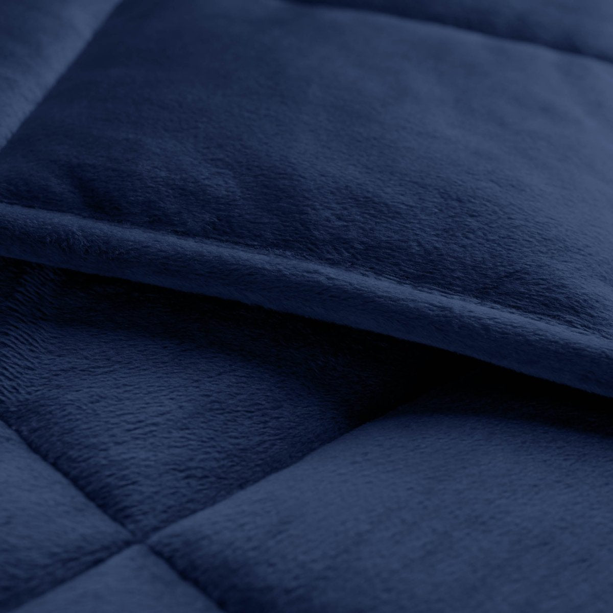 Close-up of a weighted blanket showing the stitching and texture