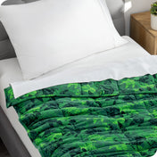 A weighted blanket laid out on a bed.