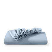 Microfiber fitted sheet folded with a white background