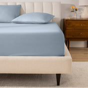 A mattress with a percale fitted sheet on it