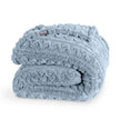 Cable knit faux shearling blanket folded