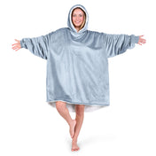 An adult with a sherpa wearable blanket on
