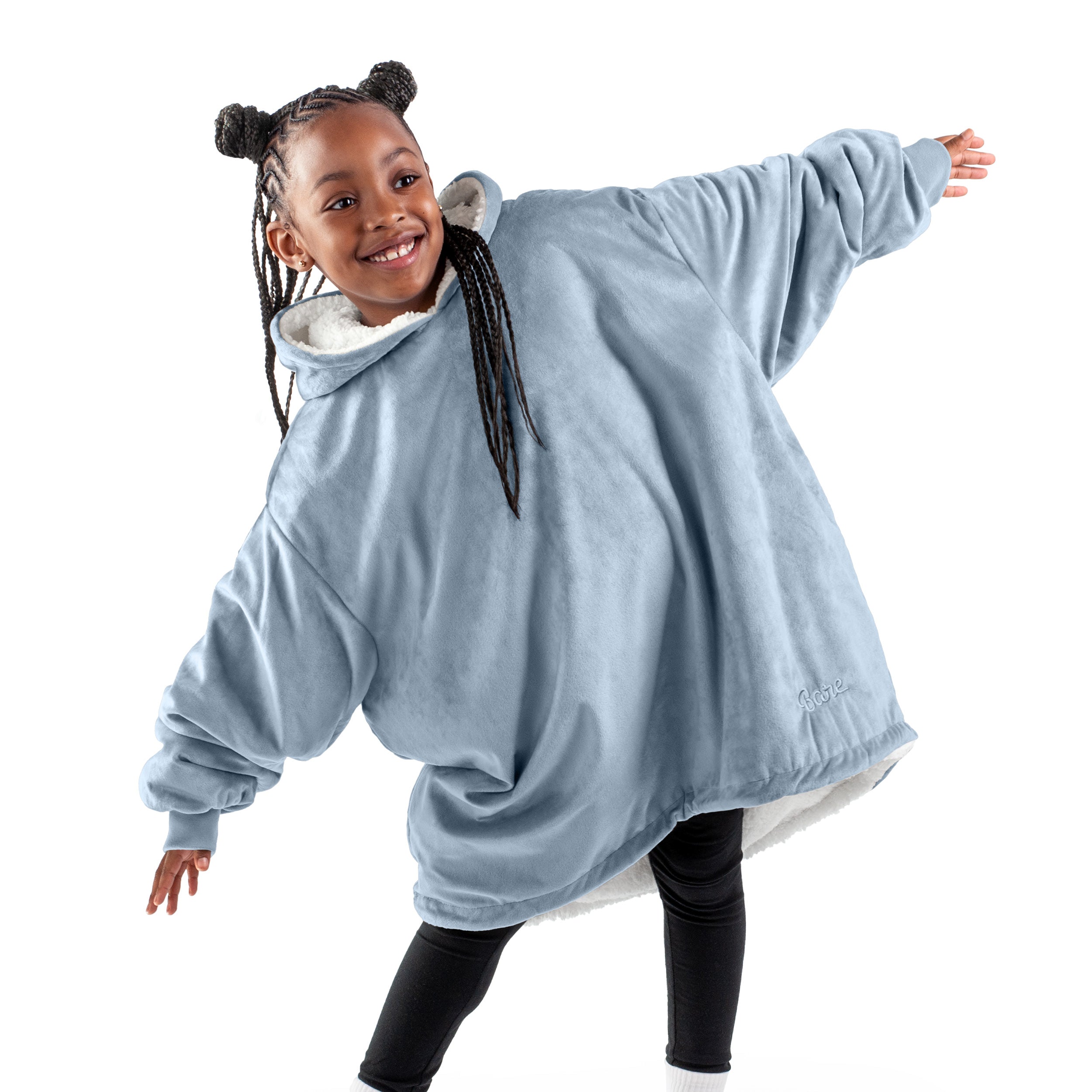 A child with a wearable blanket on