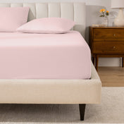 A mattress with a percale fitted sheet on it