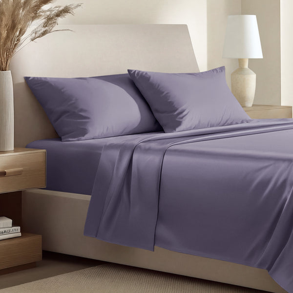 Sateen bedding set including a fitted sheet and two matching pillowcases on a bed.