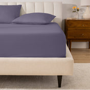 A mattress with a percale fitted sheet on it