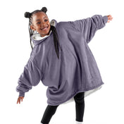A child with a wearable blanket on