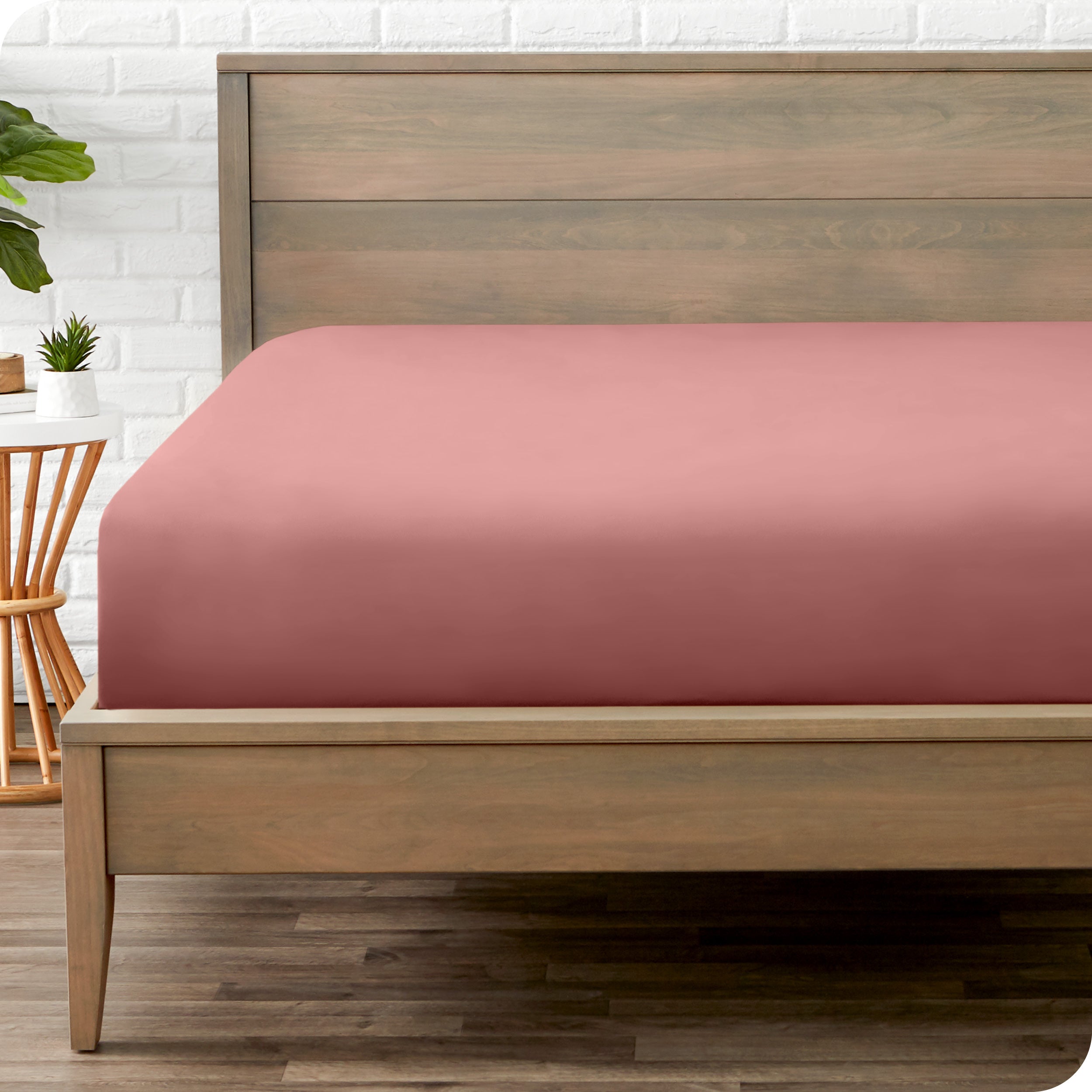 A mattress with just a fitted sheet on it