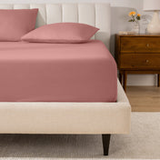 A mattress with a percale fitted sheet on it