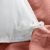 Close up of the corner ties on a duvet cover for attaching a duvet insert