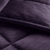 Close-up of a weighted blanket showing the stitching and texture