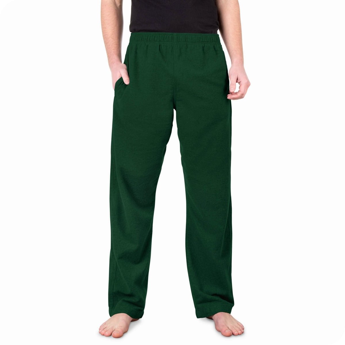 A man standing with flannel pajama pants on