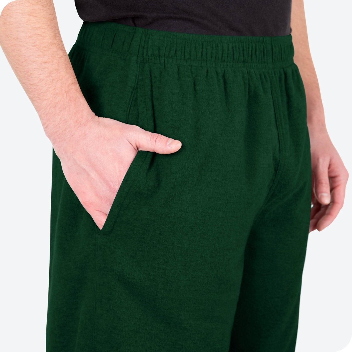 Close-up of a flannel pajama pocket with a man's hand in the pocket.