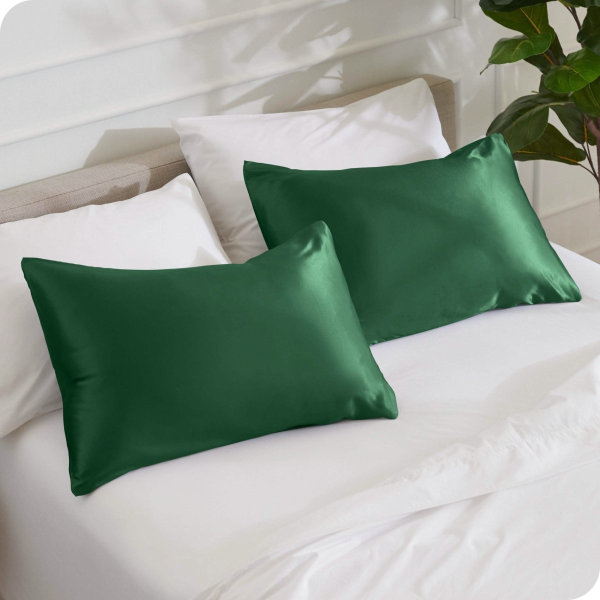 2 mulberry silk pillowcases on pillows set on a bed