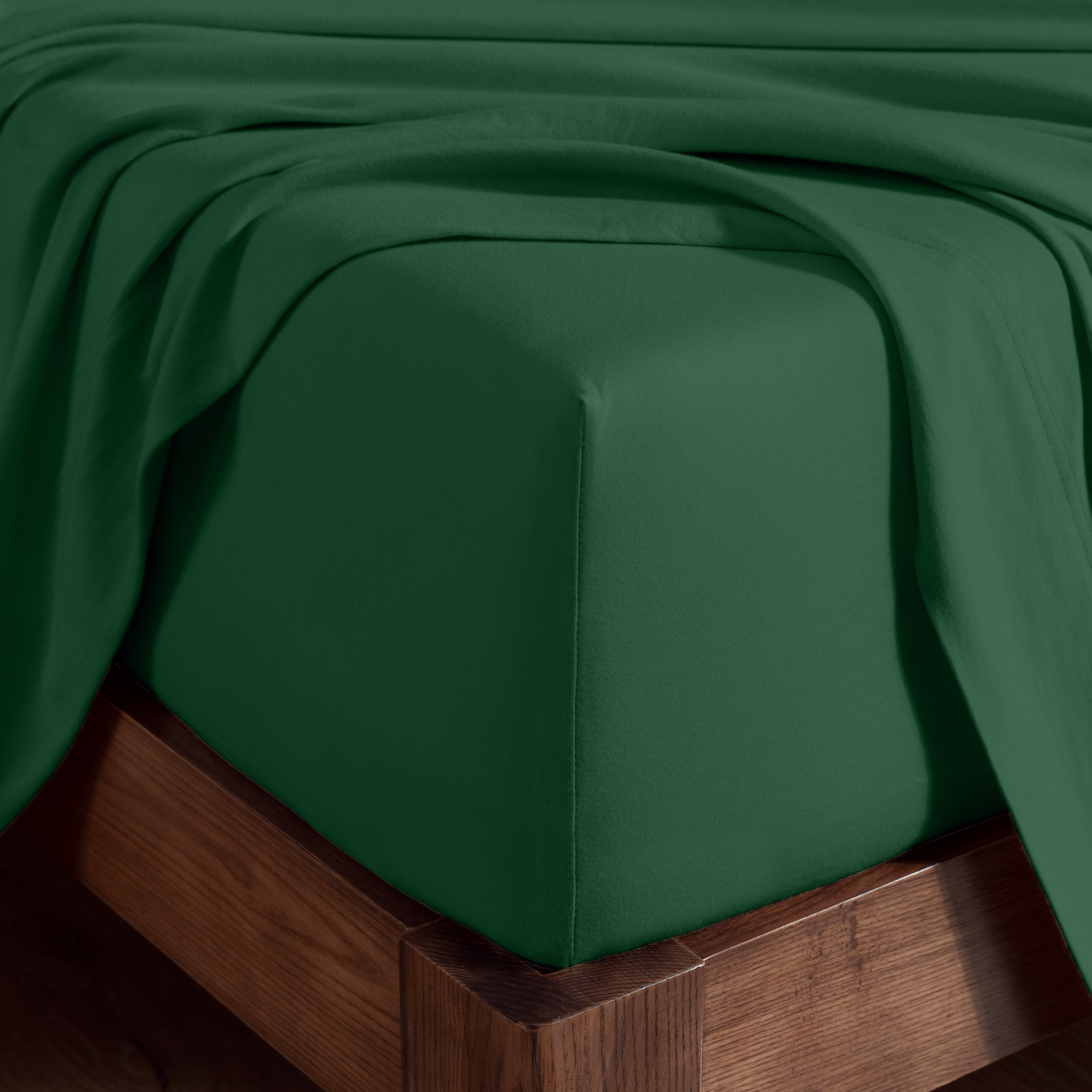 Organic cotton jersey sheet set on a wooden bed frame