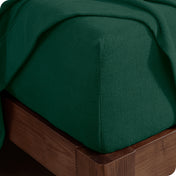 Fitted sheet on a wooden bed frame