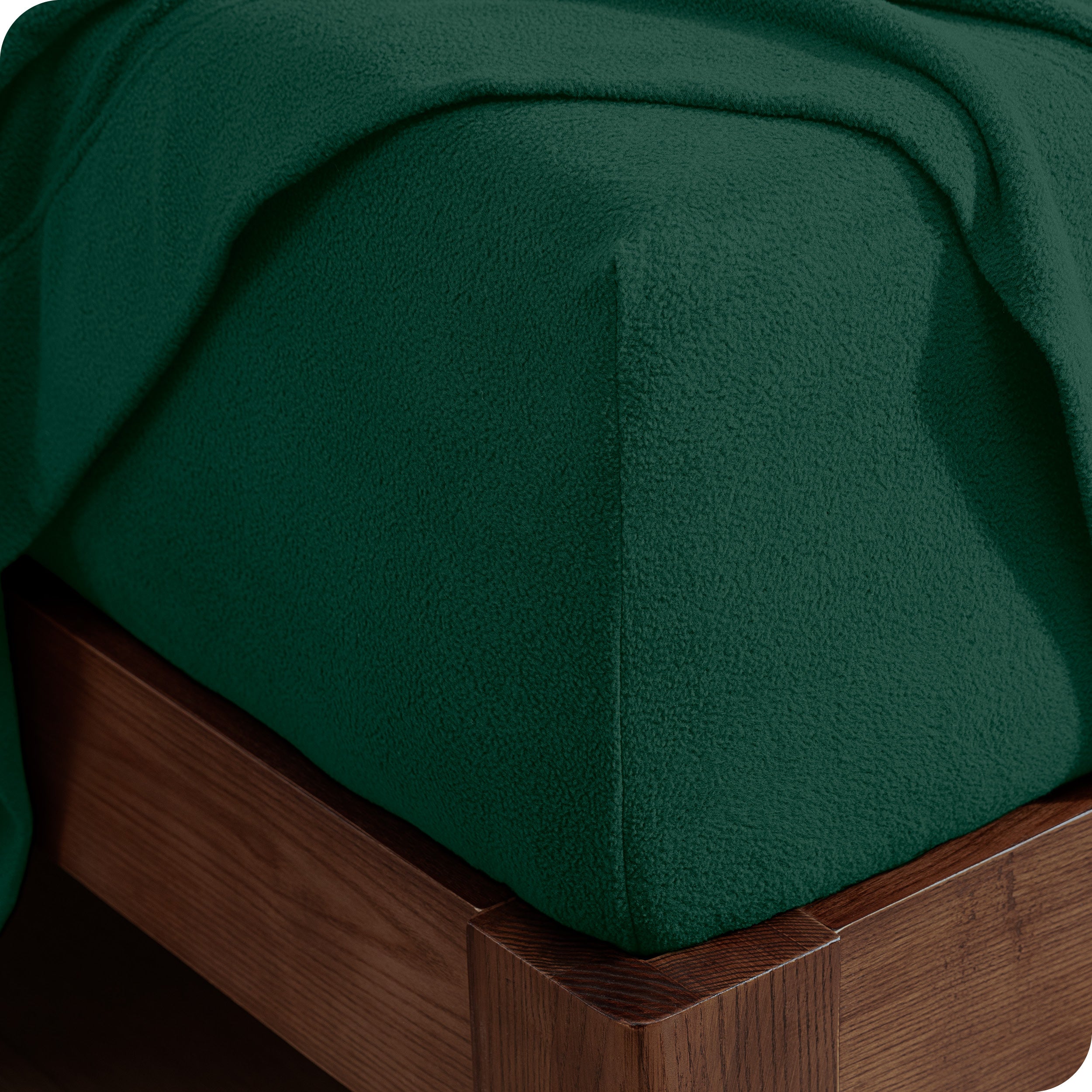 Fitted sheet on a wooden bed frame