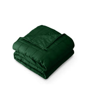 A folded cotton weighted blanket with a white background