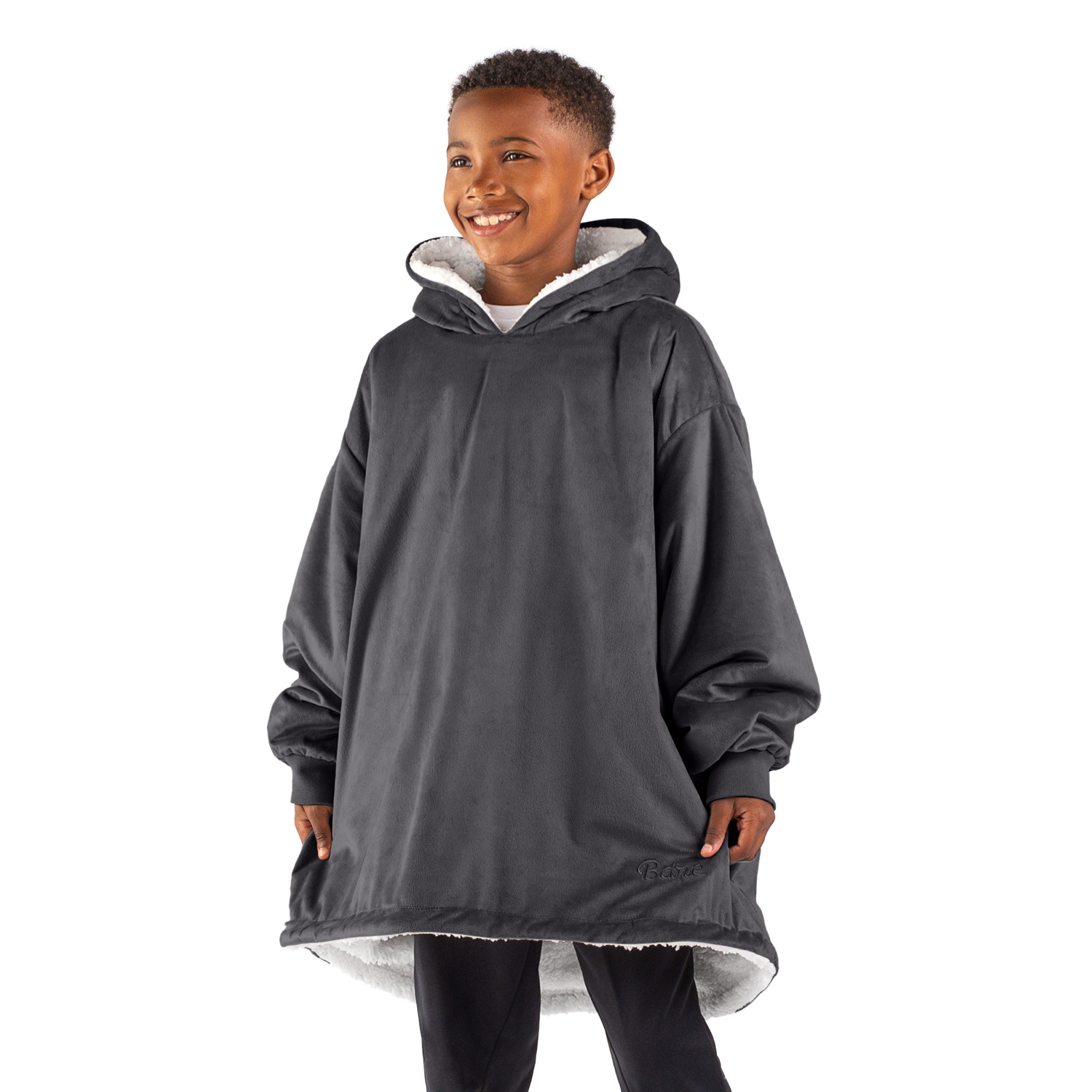 A child with a sherpa wearable blanket on