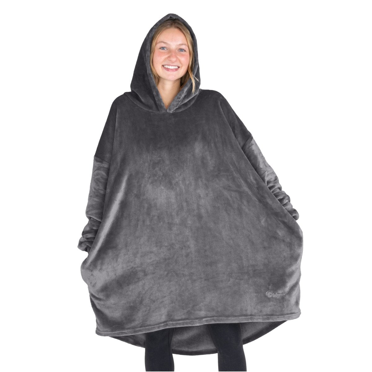 A woman wearing a cozy hooded blanket