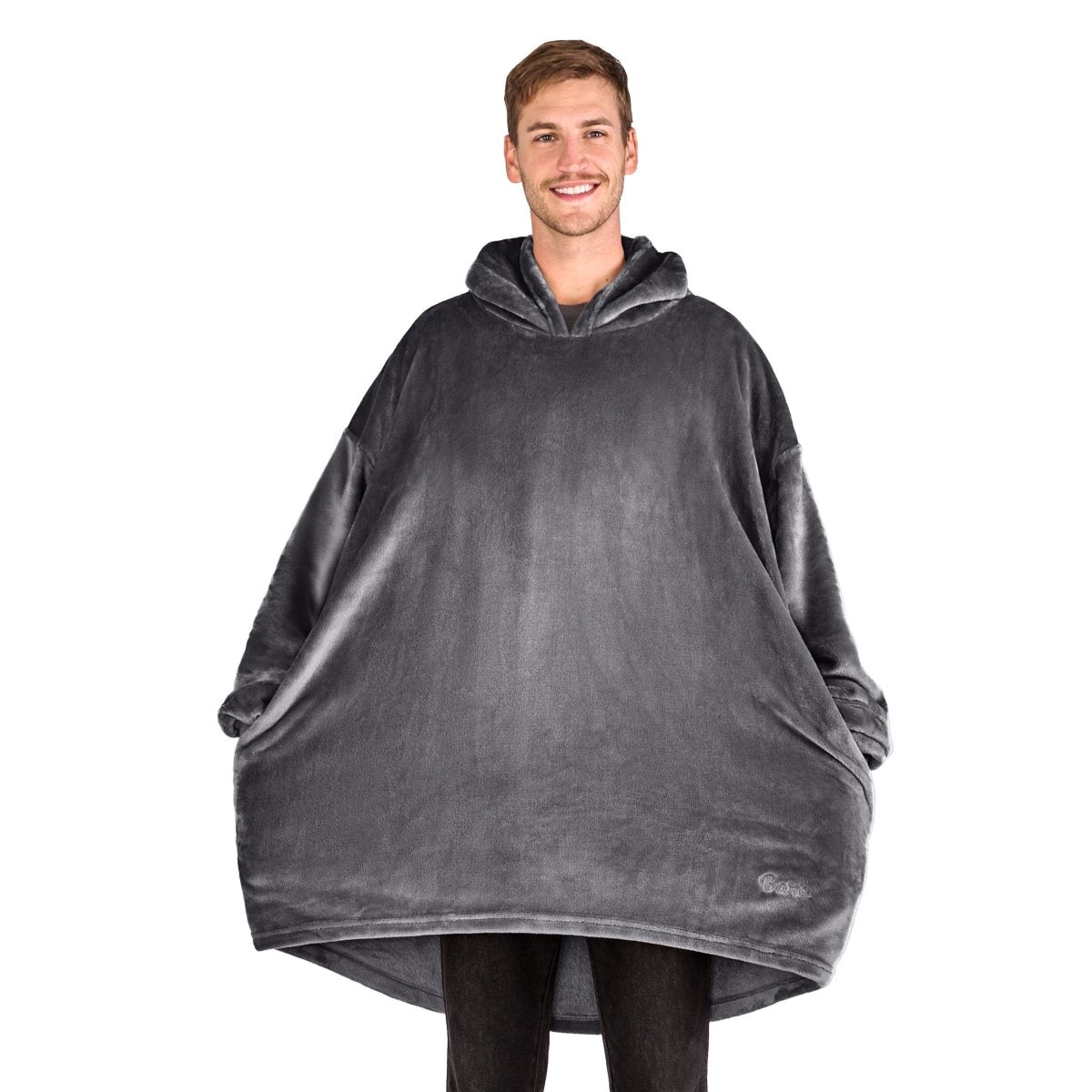 A man standing with a wearable blanket on
