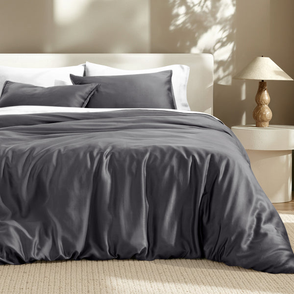 Bedding set on a bed with a lamp in the background