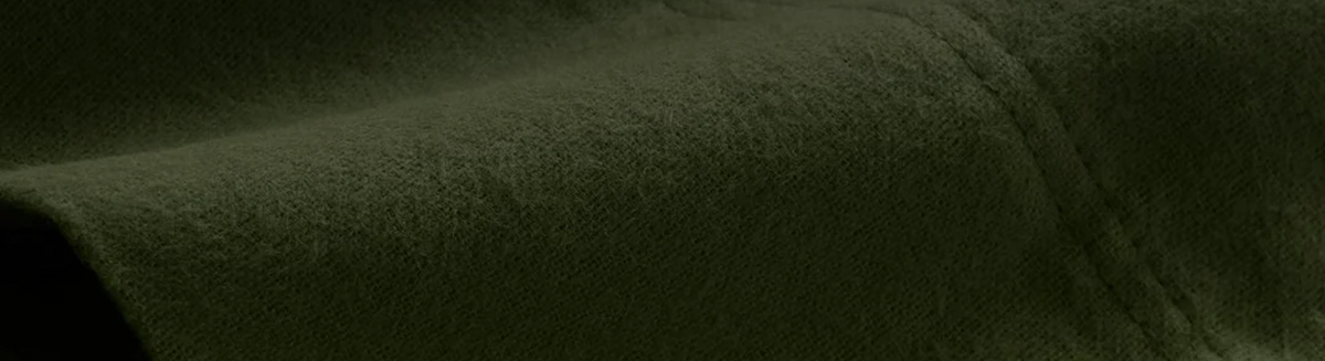 Close-up of dark green fabric texture