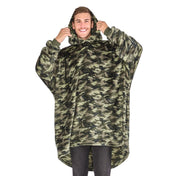A man wearing a hooded blanket made of microplush, showcasing comfort and warmth.
