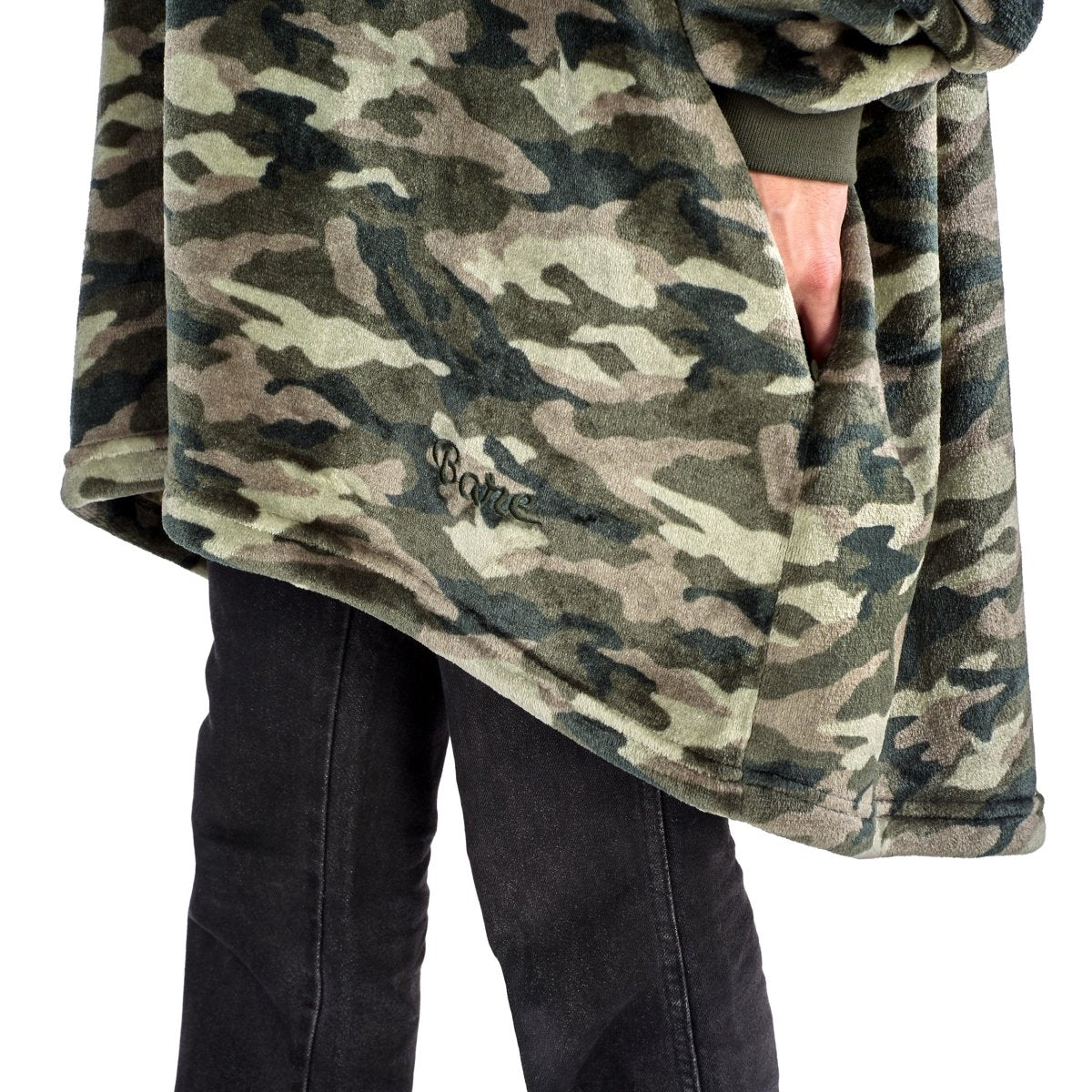 A man in a hooded microplush wearable blanket.