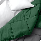 Close up of a comforter folded back to show the different colored sides