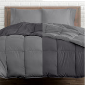 A wooden bed frame with a reversible comforter and sheet set on the mattress