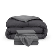 A reversible microfiber comforter and a coordinating sheet set folded and stacked
