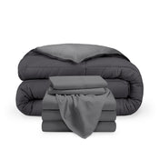 A reversible microfiber comforter and a coordinating sheet set folded and stacked