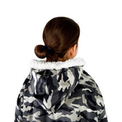 A child with a sherpa wearable blanket on