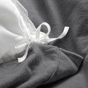 Close-up of the ties on a flannel duvet cover