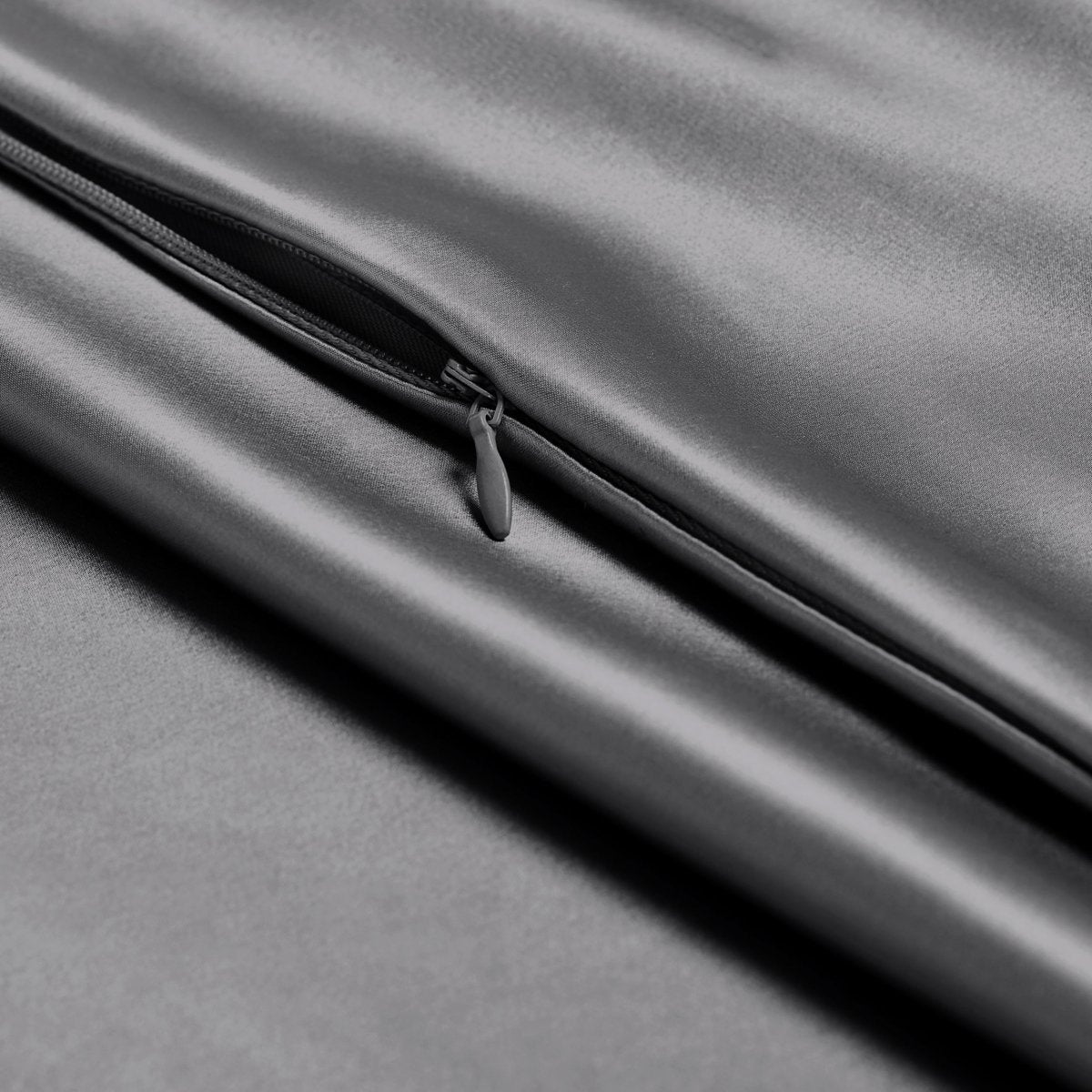 Close-up of a satin pillowcase with a zipper