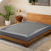 Grey box spring cover on a box spring